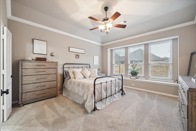 8143 Black Percher St, Conroe, TX 77385 - bedroom with light colored carpet, crown molding, baseboards, a ceiling fan, and a raised ceiling