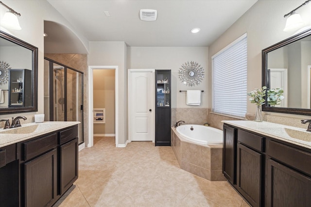 8143 Black Percher St, Conroe, TX 77385 - full bath with a stall shower, two vanities, a bath, and tile patterned flooring