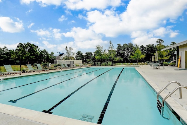 8143 Black Percher St, Conroe, TX 77385 - community pool featuring a patio area