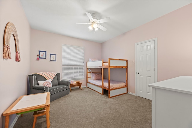 bedroom featuring baseboards, ceiling fan, and carpet