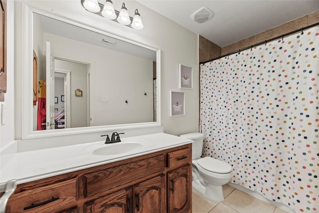 full bath featuring tile patterned floors, vanity, toilet, and visible vents