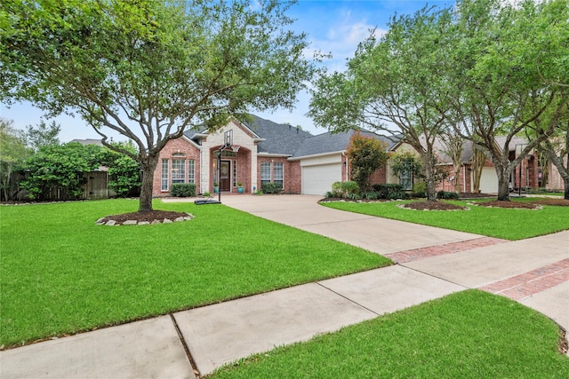 ranch-style home featuring fence, an attached garage, a front lawn, brick siding, and concrete driveway