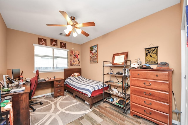 bedroom featuring a ceiling fan, light wood-style flooring, and visible vents