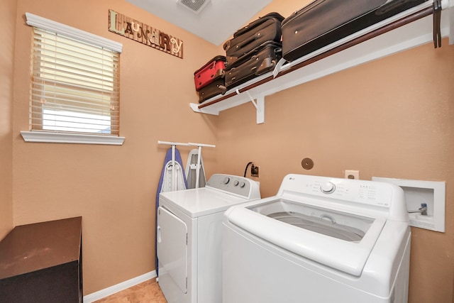 laundry room with laundry area, baseboards, washer and dryer, and visible vents