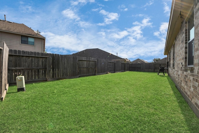 view of yard featuring a fenced backyard