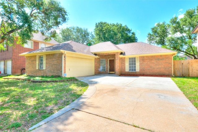 view of front of property with a garage, brick siding, fence, and driveway
