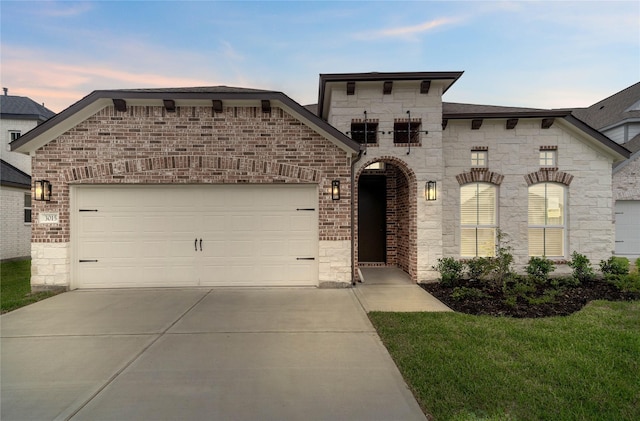 3015 Knotty Forest Dr, Spring, TX 77373 - french country home with concrete driveway, stone siding, an attached garage, and brick siding