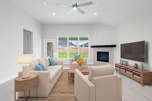 3015 Knotty Forest Dr, Spring, TX 77373 - living room featuring a glass covered fireplace, ceiling fan, recessed lighting, and vaulted ceiling