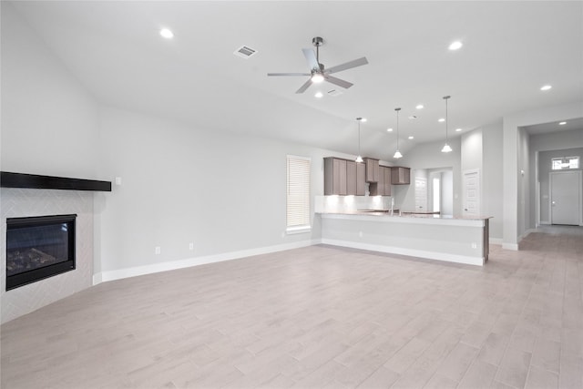 3015 Knotty Forest Dr, Spring, TX 77373 - unfurnished living room with recessed lighting, a ceiling fan, light wood finished floors, baseboards, and a fireplace