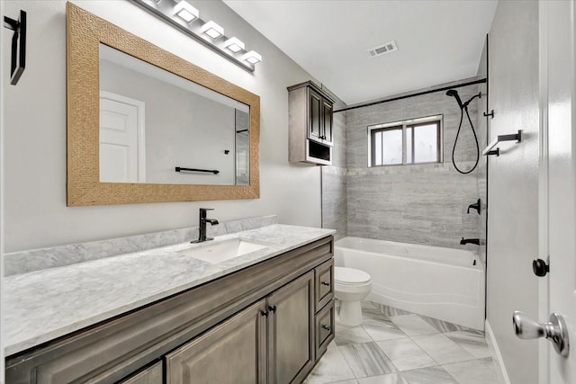 bathroom featuring vanity, toilet, marble finish floor, visible vents, and tub / shower combination