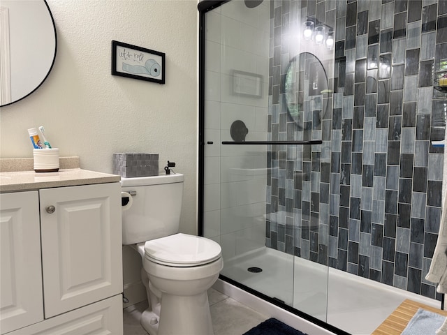211 Southern Oaks Dr, Lake Jackson, TX 77566 - bathroom featuring toilet, a stall shower, tile patterned flooring, and vanity