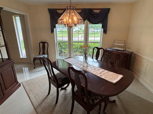 16514 Laurelfield Dr, Houston, TX 77059 - dining room with a chandelier, plenty of natural light, and wainscoting