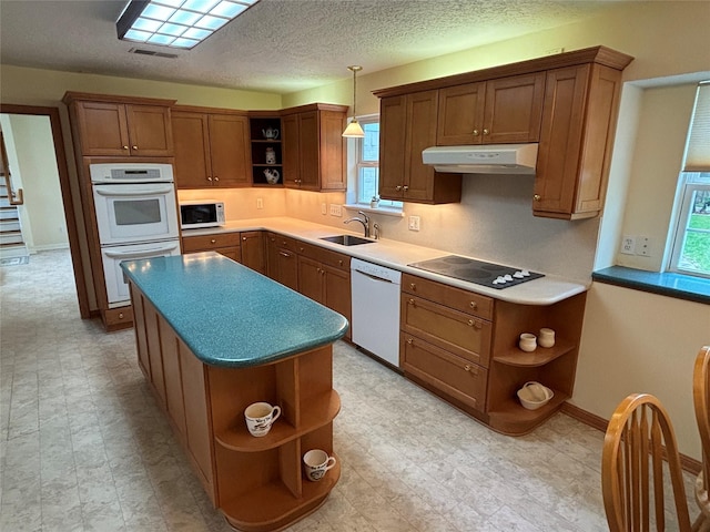 16514 Laurelfield Dr, Houston, TX 77059 - kitchen featuring open shelves, white appliances, under cabinet range hood, a sink, and a kitchen island