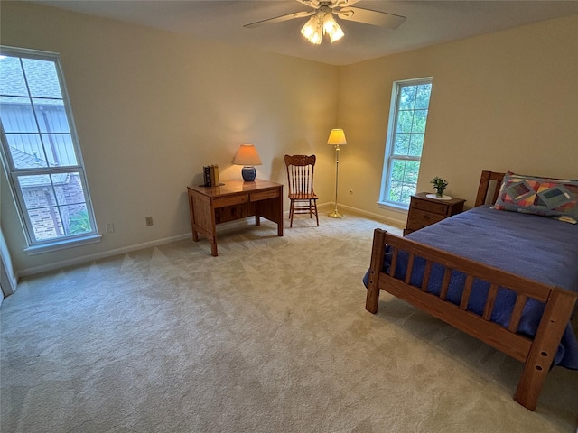 16514 Laurelfield Dr, Houston, TX 77059 - bedroom featuring light carpet, baseboards, and a ceiling fan