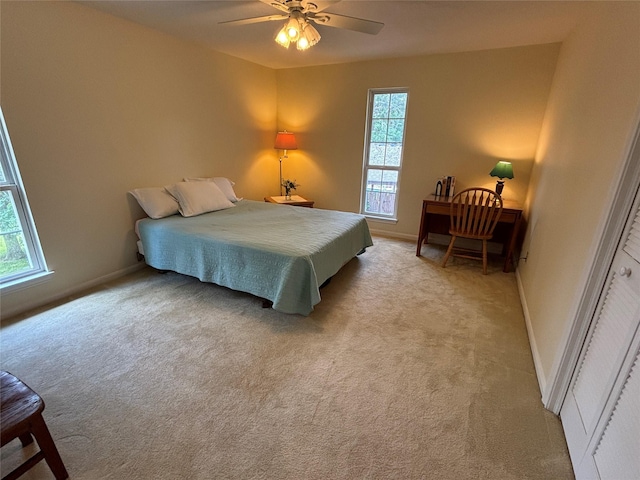 16514 Laurelfield Dr, Houston, TX 77059 - bedroom featuring multiple windows, baseboards, and light colored carpet