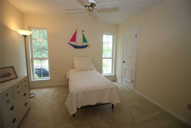 16514 Laurelfield Dr, Houston, TX 77059 - bedroom with multiple windows, light colored carpet, baseboards, and a ceiling fan