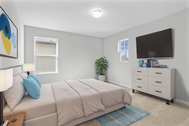 bedroom featuring light colored carpet and baseboards