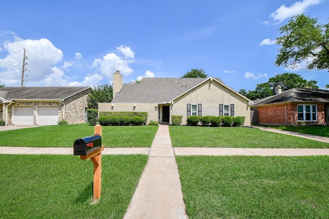 ranch-style house featuring a chimney, brick siding, and a front lawn