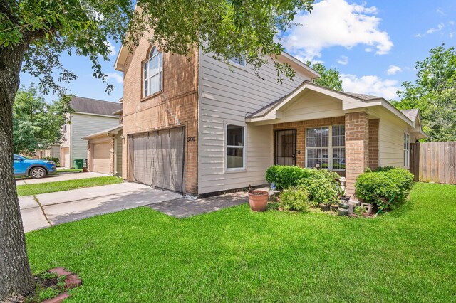 5930 Santa Bernadetta, Houston, TX 77017 - view of front of home with brick siding, fence, a garage, a front lawn, and concrete driveway