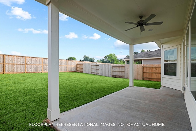 view of yard with a patio, a fenced backyard, and a ceiling fan