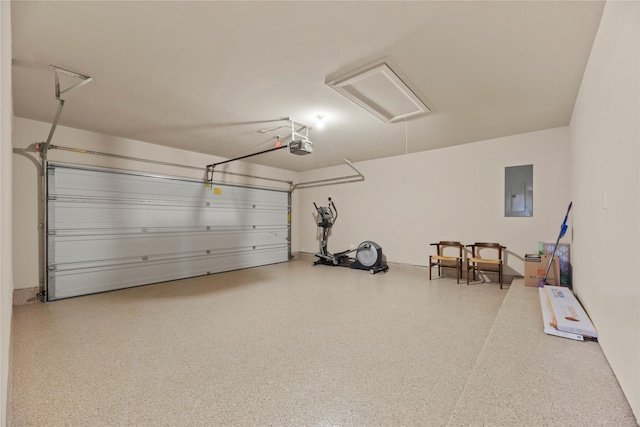garage with a garage door opener and electric panel