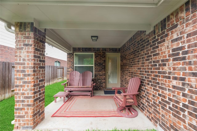 view of patio / terrace featuring fence