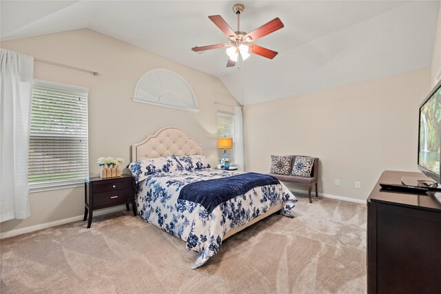 bedroom with multiple windows, carpet flooring, and vaulted ceiling