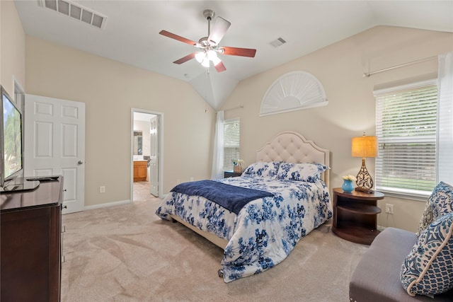 carpeted bedroom featuring visible vents, a ceiling fan, connected bathroom, and vaulted ceiling