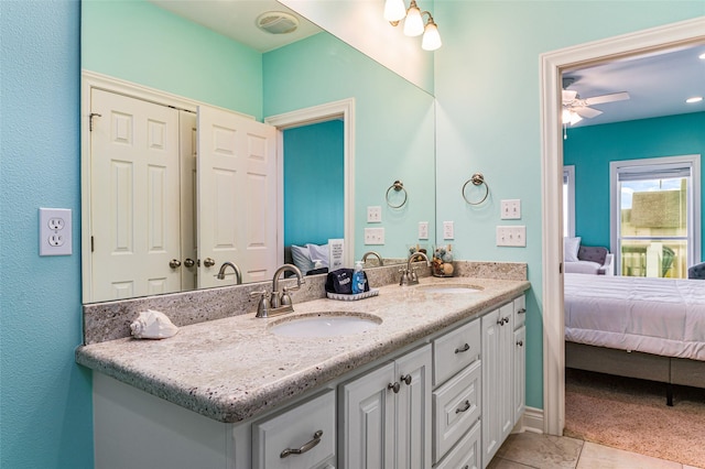 3347 Prides Way, Crystal Beach, TX 77650 - ensuite bathroom featuring double vanity, a sink, ceiling fan, and ensuite bathroom