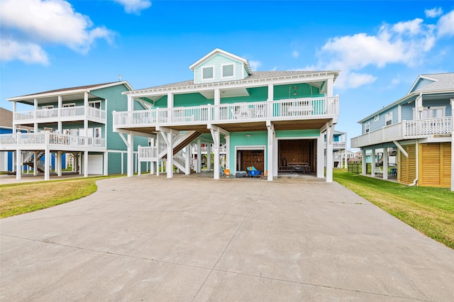 3347 Prides Way, Crystal Beach, TX 77650 - coastal home with a carport, driveway, and stairs