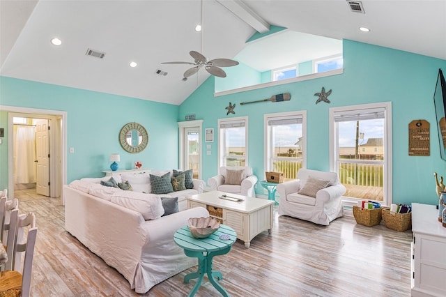 3347 Prides Way, Crystal Beach, TX 77650 - living area featuring light wood-style flooring, visible vents, ceiling fan, and high vaulted ceiling