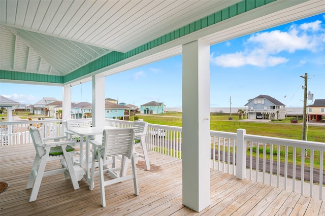 3347 Prides Way, Crystal Beach, TX 77650 - wooden deck featuring a residential view, a lawn, and outdoor dining space