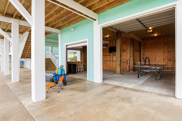 3347 Prides Way, Crystal Beach, TX 77650 - exterior space with concrete flooring, stairway, and wood walls