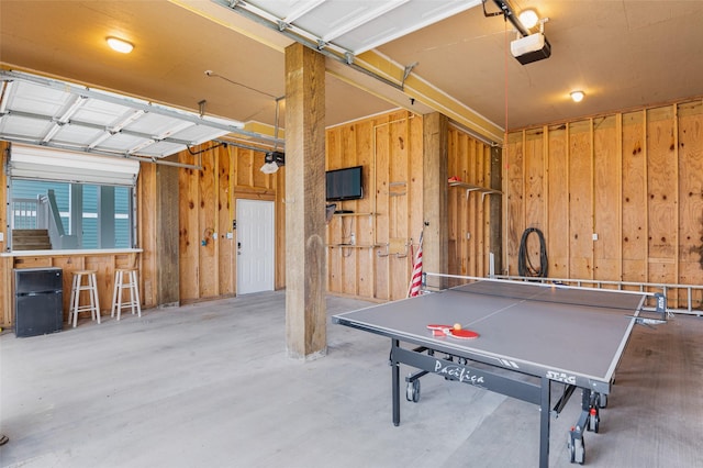 3347 Prides Way, Crystal Beach, TX 77650 - rec room with wooden walls and a garage