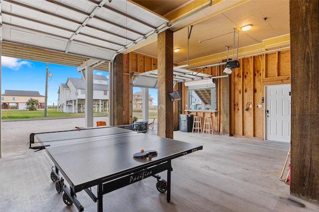 3347 Prides Way, Crystal Beach, TX 77650 - recreation room with wood walls, a healthy amount of sunlight, and a garage