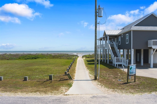 3347 Prides Way, Crystal Beach, TX 77650 - exterior space with driveway, stairs, and a water view