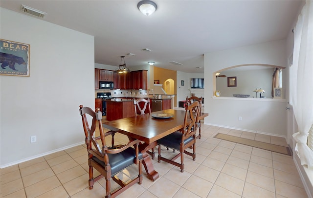 dining room featuring light tile patterned floors and visible vents