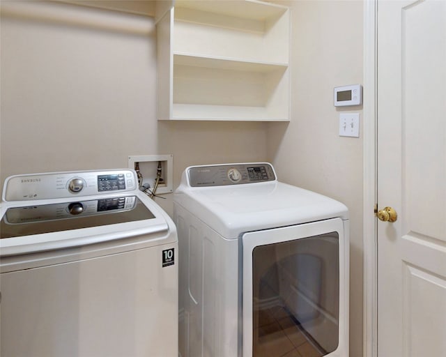 washroom featuring laundry area and washing machine and dryer