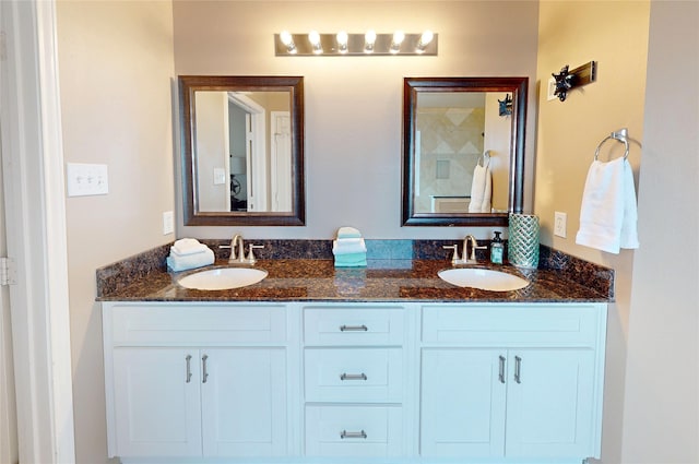 bathroom featuring double vanity and a sink