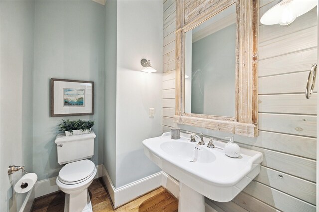 412 Redan St, Houston, TX 77009 - bathroom with toilet, baseboards, and wood finished floors