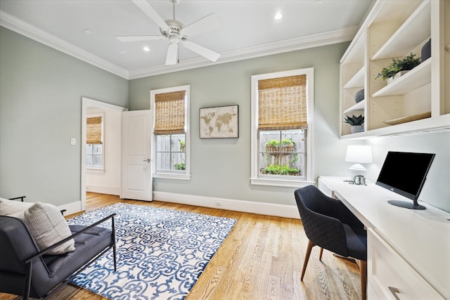 412 Redan St, Houston, TX 77009 - office area featuring ornamental molding, baseboards, a ceiling fan, built in desk, and light wood-style flooring