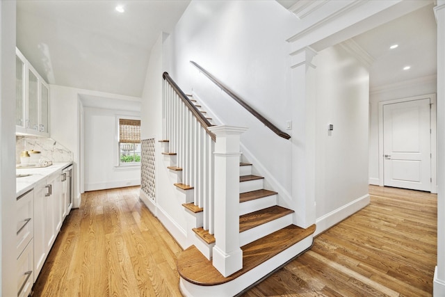 412 Redan St, Houston, TX 77009 - staircase featuring wood finished floors, baseboards, recessed lighting, and ornamental molding