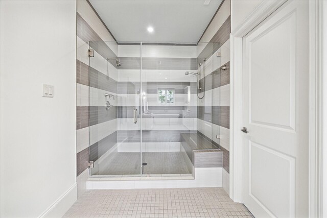 412 Redan St, Houston, TX 77009 - bathroom with a stall shower and tile patterned flooring
