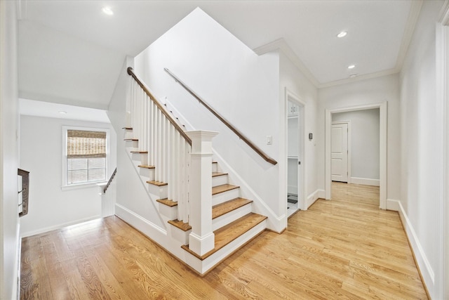 412 Redan St, Houston, TX 77009 - stairway with wood finished floors, recessed lighting, baseboards, and crown molding