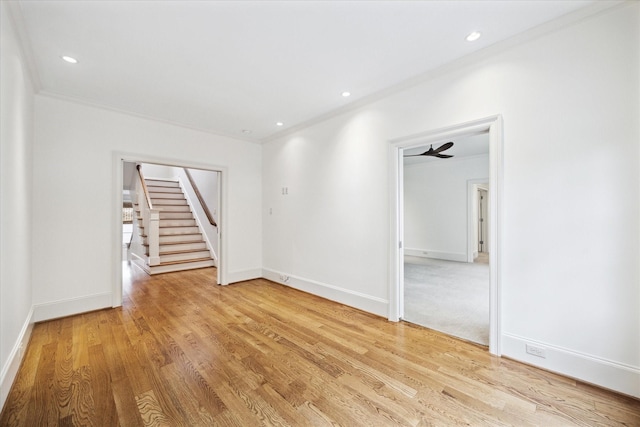 412 Redan St, Houston, TX 77009 - unfurnished room featuring light wood finished floors, stairway, baseboards, recessed lighting, and ornamental molding