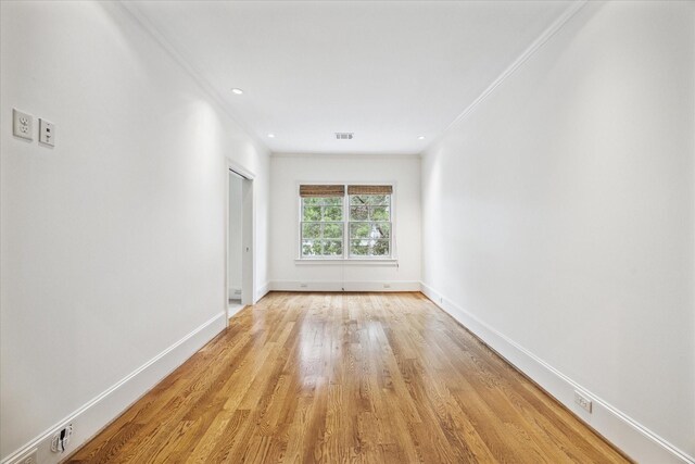412 Redan St, Houston, TX 77009 - spare room with light wood-style floors, baseboards, and ornamental molding