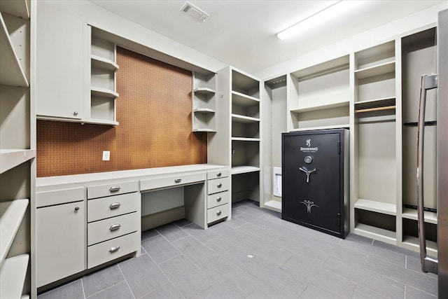 412 Redan St, Houston, TX 77009 - spacious closet with built in study area and tile patterned floors