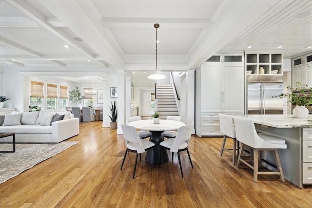 412 Redan St, Houston, TX 77009 - dining area with stairway, light wood-style flooring, beam ceiling, a chandelier, and recessed lighting