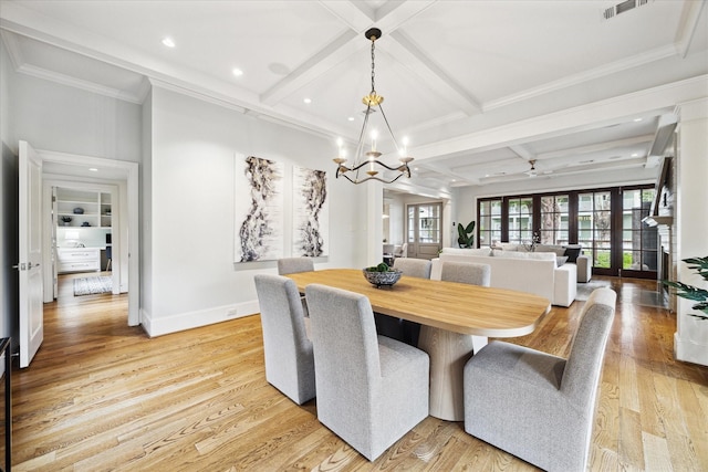 412 Redan St, Houston, TX 77009 - dining room with coffered ceiling, a chandelier, baseboards, light wood finished floors, and beamed ceiling