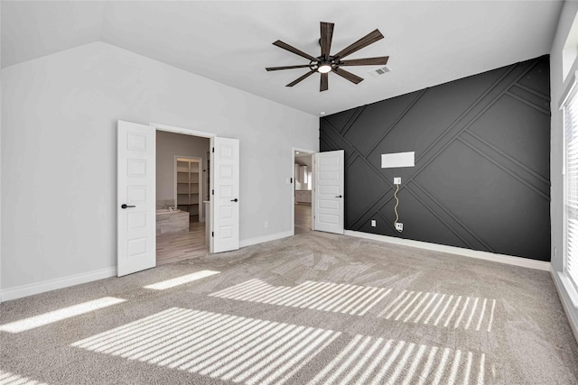 9306 Eckert Rd, Iowa Colony, TX 77583 - unfurnished bedroom featuring visible vents, carpet flooring, vaulted ceiling, and baseboards